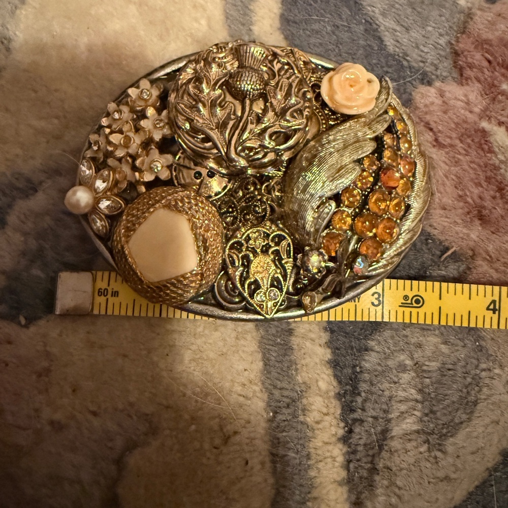 Gold tones for this blinged out belt buckle 3 1/2 x 2/1/2, fits onto a 1 1/2